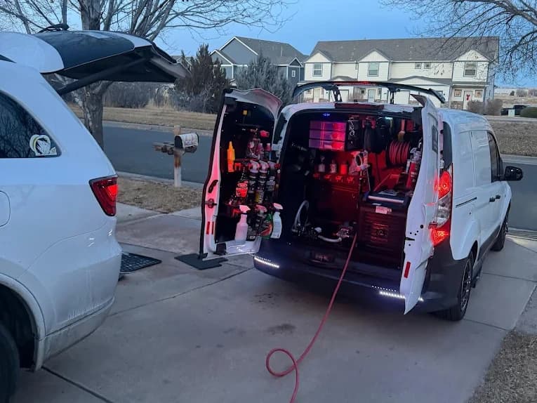 The fully stocked van set up on a customer's property, hose run out to the vehicle